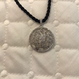 Silver circle charm on 16” black rope necklace